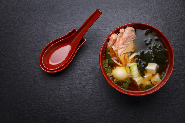 Japanese cuisine. Soup over black background. - Photo, Image