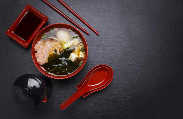 Japanese cuisine. Soup over black background. - Фото, зображення