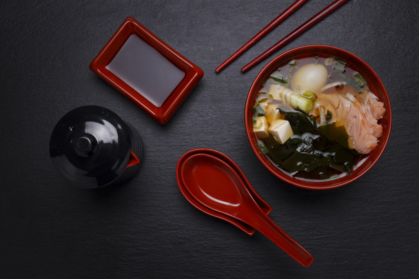 Japanese cuisine. Soup over black background. - Φωτογραφία, εικόνα