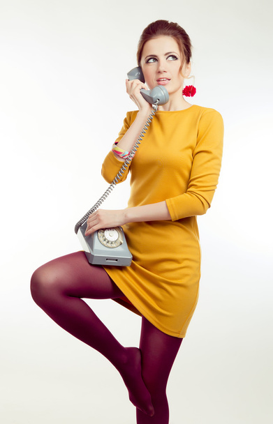elegant female with vintage make-up talking on the retro phone with receiver  - Foto, Imagem