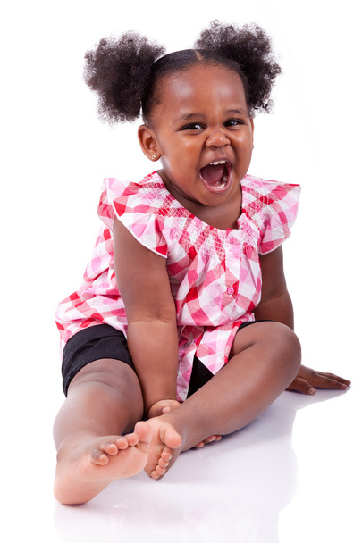 Cute little african american girl laughing - 写真・画像