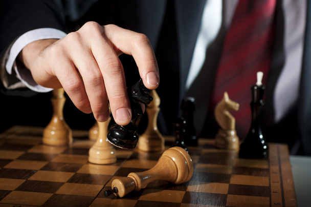 Businessman plays chess - 写真・画像