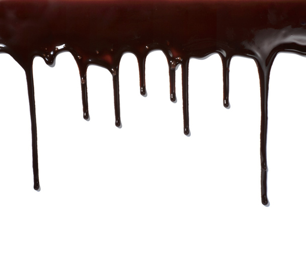 Jarabe de chocolate que gotea alimento dulce líquido
 - Foto, Imagen