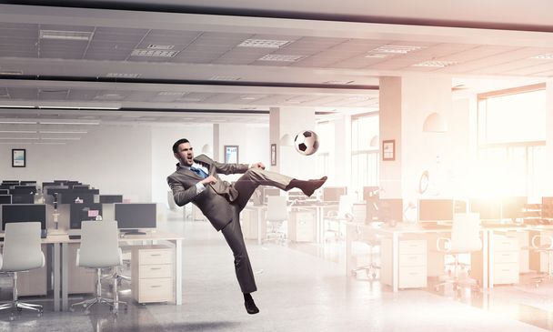 Playing football in office - Valokuva, kuva