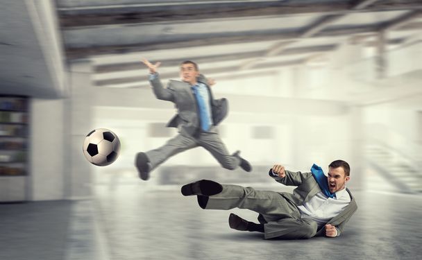 Playing football in office - Fotó, kép