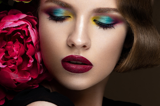 Beautiful girl with colorful make-up, flowers, retro hairstyle. beauty face. - Φωτογραφία, εικόνα