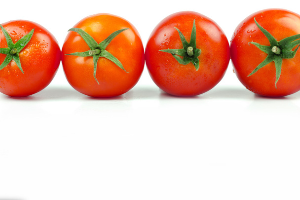 Tomatoes. Whole and a half isolated on white - Photo, Image