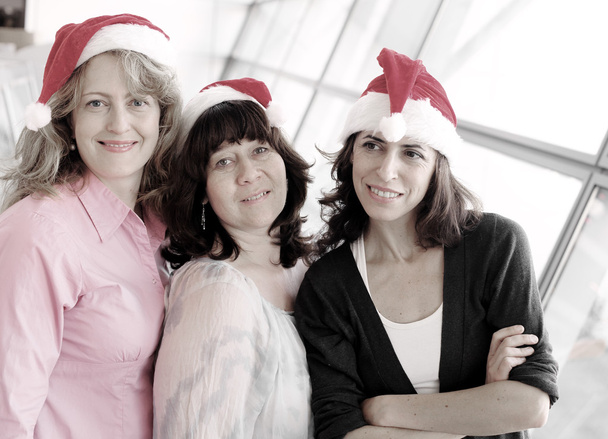 mujeres que usan sombrero de Navidad
 - Foto, imagen