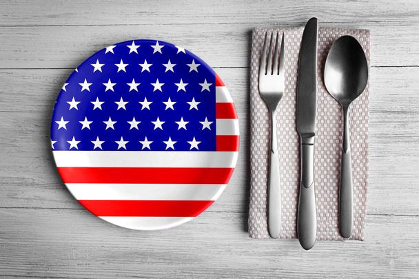 Plate with silver cutlery on  background.  - Zdjęcie, obraz
