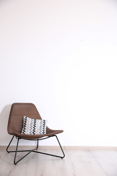 chair on wall background - Фото, изображение