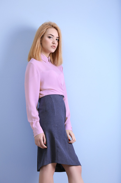 young woman in pink shirt and grey skirt - Foto, Imagen