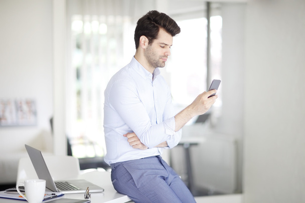 businessman texting  in office - Photo, Image