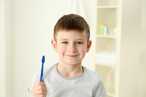 Smiling little boy brushing teeth  - Photo, Image