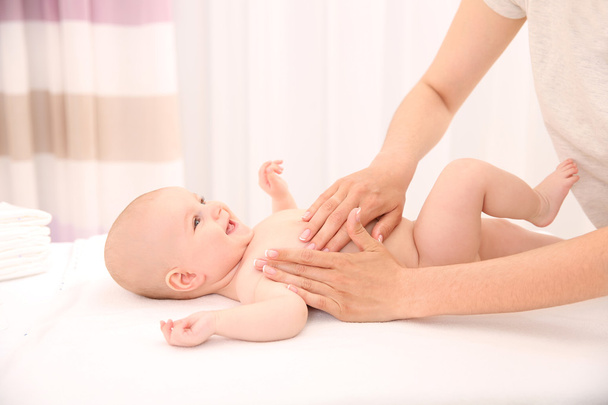 Mother hands applying cream on baby - Foto, immagini