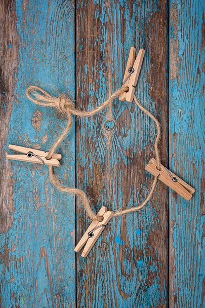 Clothespins with a rope on blue wooden boards - Foto, Imagem