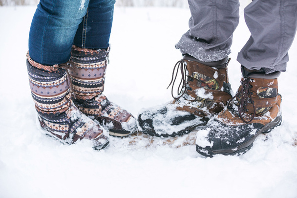 boots of young couple in forest - Photo, Image