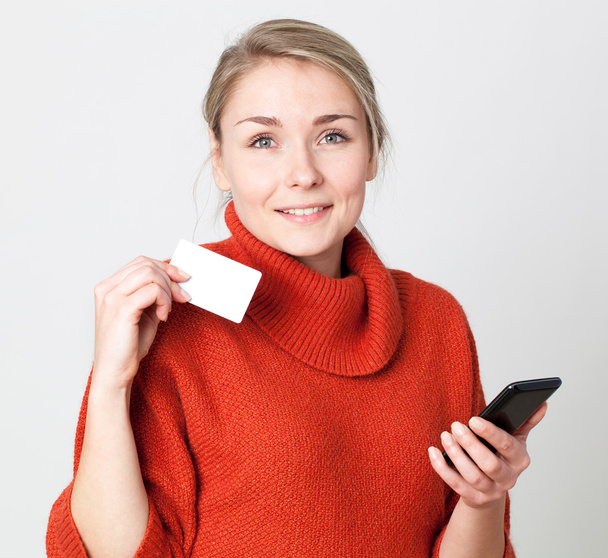 serene young blond woman purchasing online with credit card - Foto, Imagem