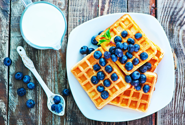 waffles with blueberries on the plate  - Фото, изображение