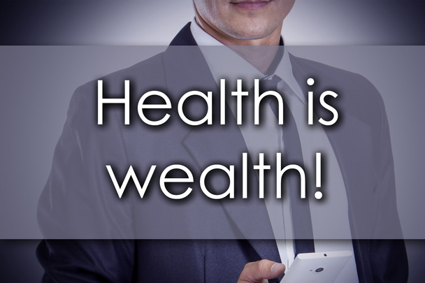 Zdraví je bohatství! -Mladý obchodník s textem-Business conce - Fotografie, Obrázek