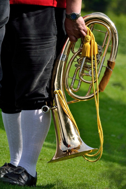 Музыкант с духовым инструментом
 - Фото, изображение