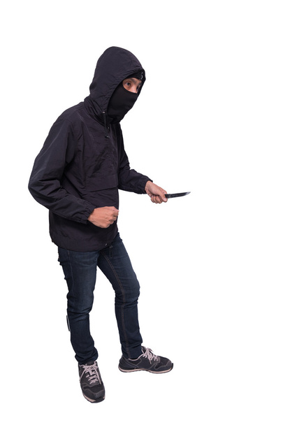Dangerous thief holding a knife/isolated on white background - Photo, Image