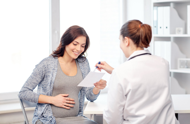 gynecologist doctor and pregnant woman at hospital - Valokuva, kuva
