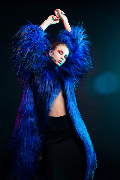 Fashion portrait of beautiful sexy woman model with creative make-up  in long  luxury coat  - Fotó, kép