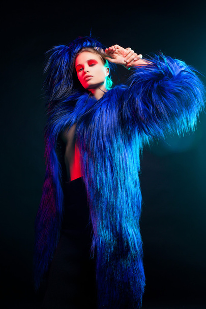 Fashion portrait of beautiful sexy woman model with creative make-up  in long  luxury coat  - 写真・画像