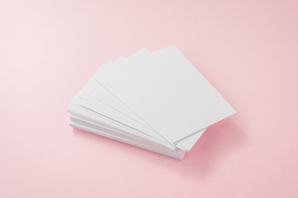 Blank business card on pink background - 写真・画像