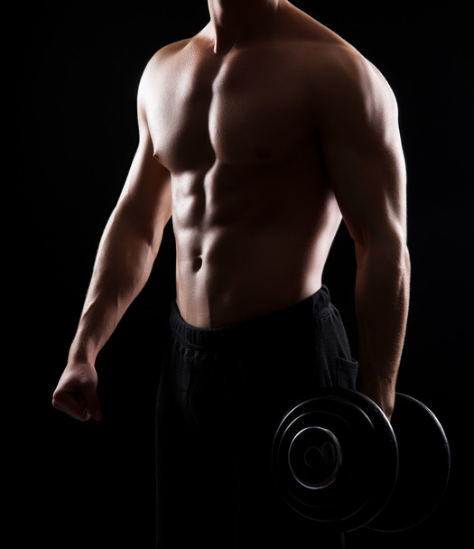 bodybuilder man with a dumbbell - 写真・画像