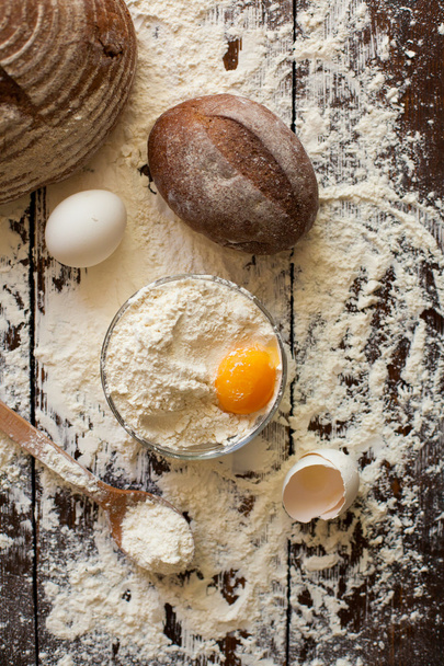 Bowl of flour with eggs and bread - Zdjęcie, obraz