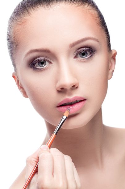 woman applying lipstick - Zdjęcie, obraz