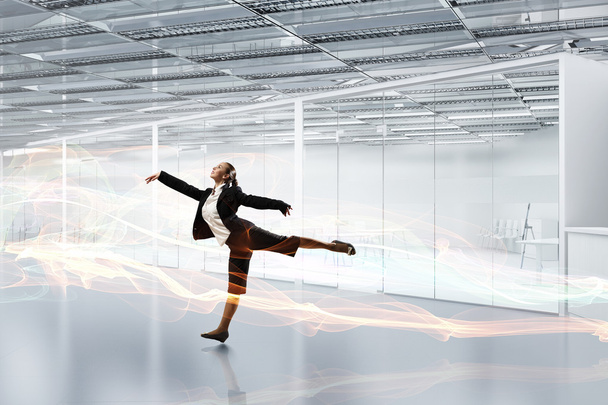Dancing businesswoman in office - Photo, image