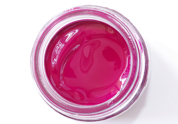 Magenta color gouache in the glass jar - Photo, Image
