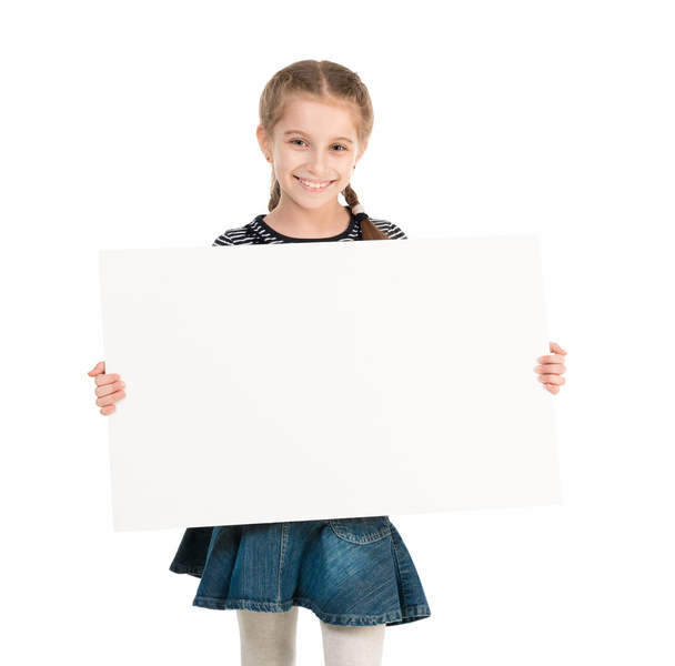 pretty schoolgirl with blank sheet in hands - Фото, изображение