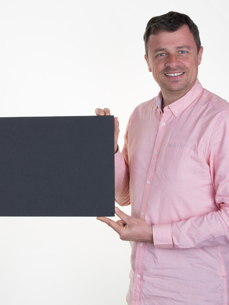 Man in pink with a blanck black board isolated - Fotó, kép