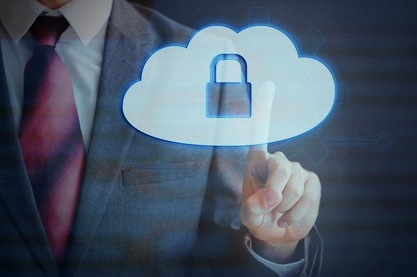 Businessman pressing Cloud computing protection conceptual icon on virtual screen. - Zdjęcie, obraz