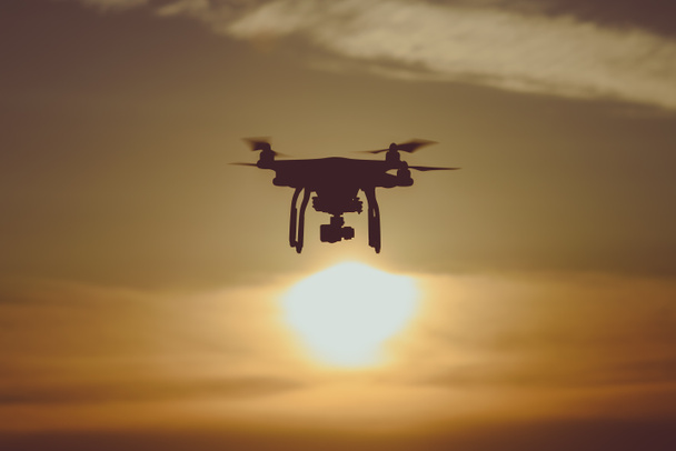 Flying drone at sunset - Photo, Image
