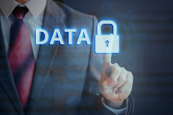 Businessman pressing DATA protection on virtual screen - internet security concept - Фото, зображення