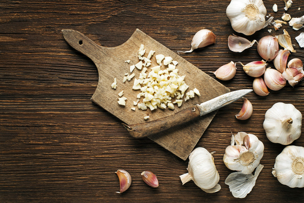 Garlic cloves on wood - Fotó, kép