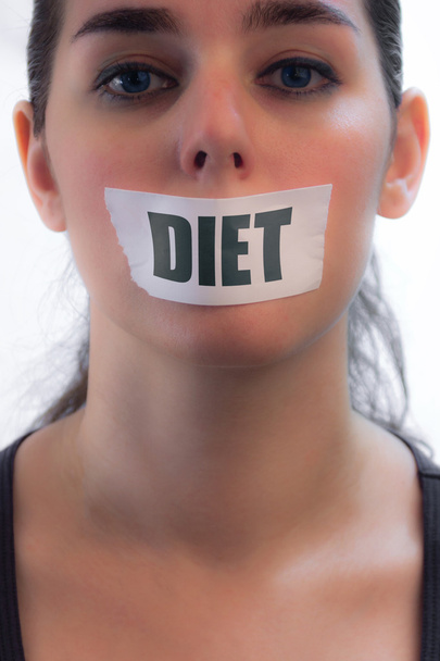 tape over mond meisje - dieet concept - geïsoleerd op witte b maken - Foto, afbeelding