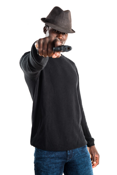 Black man holding a pistol - Fotoğraf, Görsel