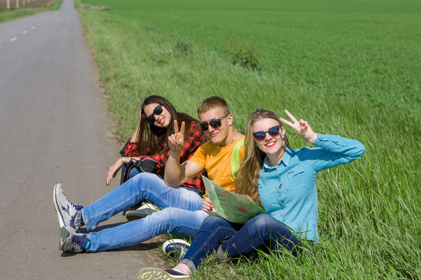 Young hipster friends travel on road - Фото, изображение