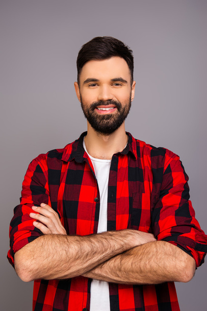 Close up portrait of cheerful happy bearded man with crossed han - 写真・画像