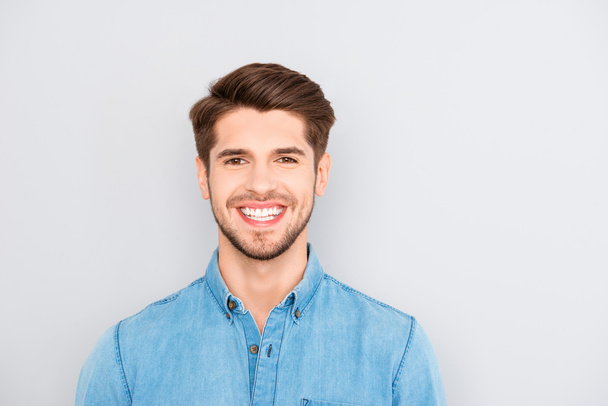 Young happy smiling man isolated on gray background - Photo, Image