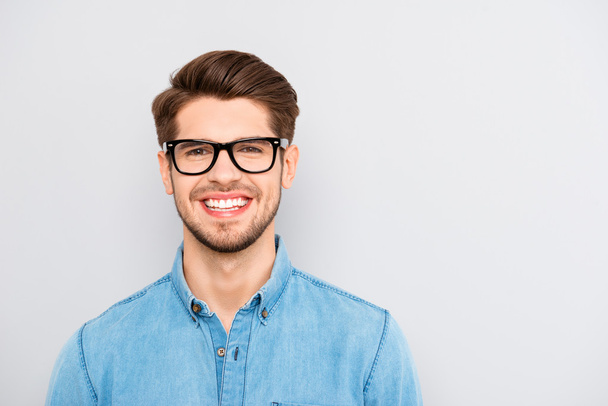 Portrait of handsome cheerful young smiling man in glasses - Photo, image