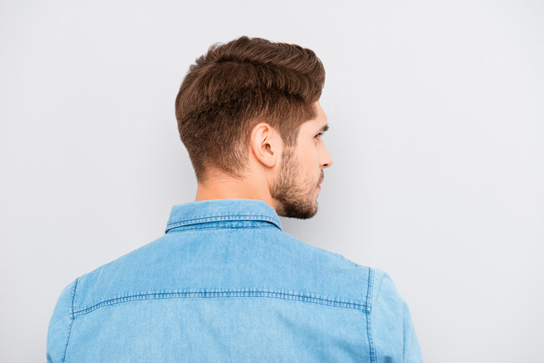 Rear view of young handsome man with bristle in blue shirt - Fotografie, Obrázek