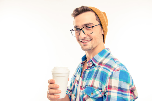 Portrait of a happy man with glasses cocktail and hat - 写真・画像