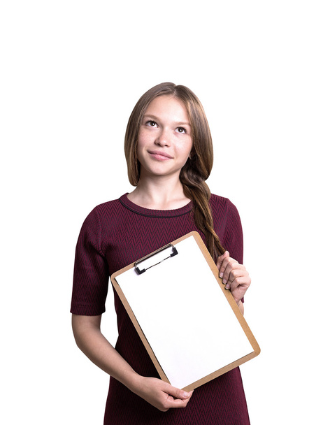 Thoughtful woman with blank clipboard - Foto, Imagen