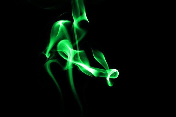 Abstract green smoke on black background - Foto, afbeelding